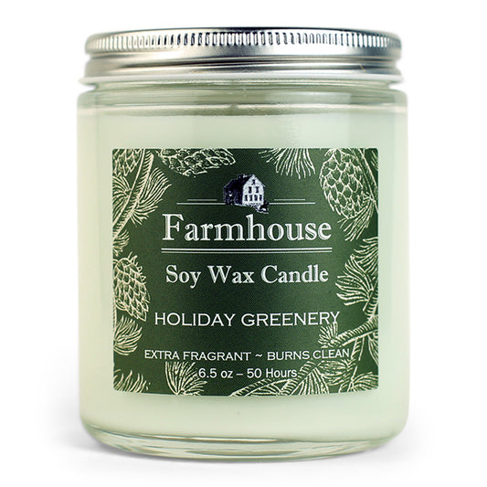 Farmhouse soy wax candle with holiday greenery fragrance on an green label
