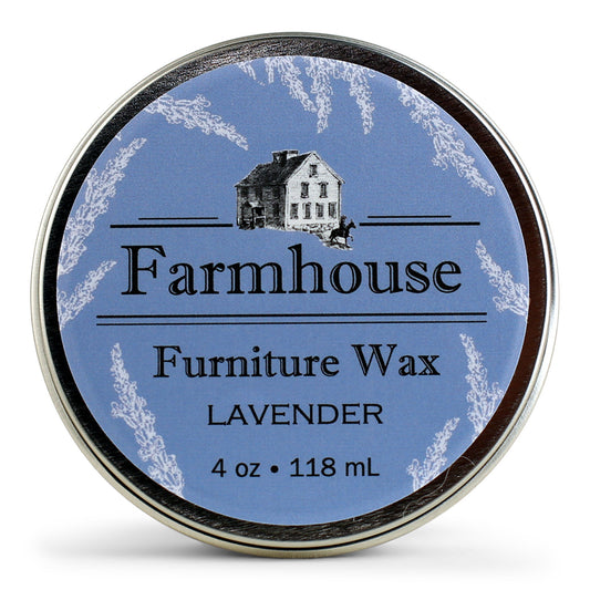 A canister of Farmhouse brand furniture wax with the label showing a house and the scent of Lavender.