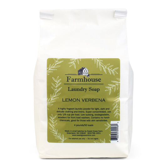 A white package of Farmhouse Laundry Soap with a label showing 'Lemon Verbena' scent. The package is marked as eco-friendly and says it is suitable for 50 loads of laundry.