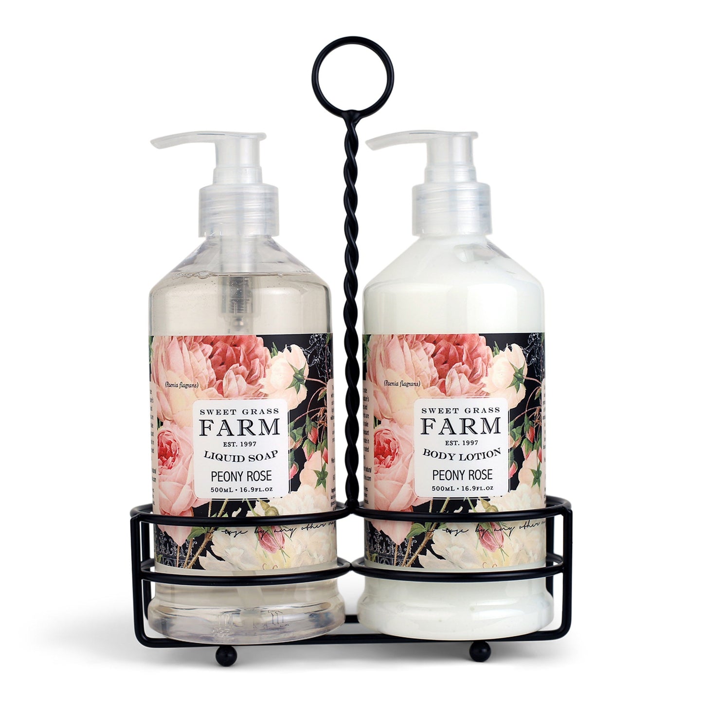 Two pump bottles of body lotion and liquid soap in a black metal caddy, with labels indicating the product Sweet Grass Farm, Meadow Collection, peony rose scent