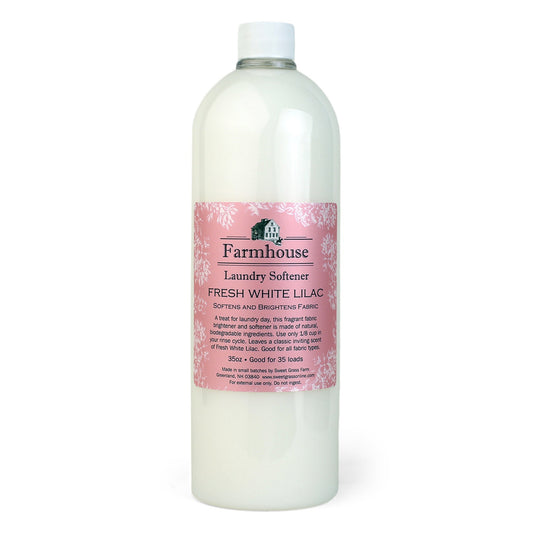 Bottle of Farmhouse Fresh White Lilac laundry softener on a white background