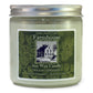 A soy wax candle jar with a label that reads 'Farmhouse Soy Wax Candle, Holiday Greenery, Extra Fragrant - Burns Clean', with a picture of a house and the brand name 'Sweet Grass Farm'.