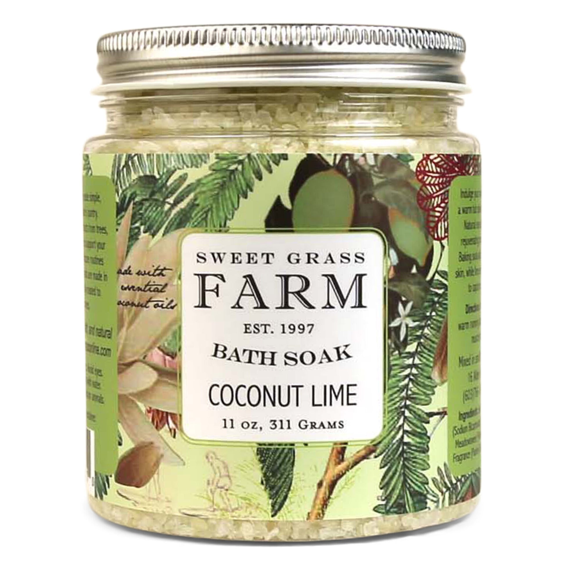 A jar of Sweet Grass Farm bath soak with a label that reads 'BATH SOAK COCONUT LIME 11oz, 311 Grams'. The jar is filled with green bath salts.