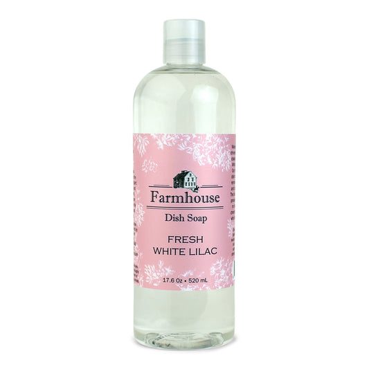A bottle of Farmhouse dish soap with a pink label and fresh white lilac scent