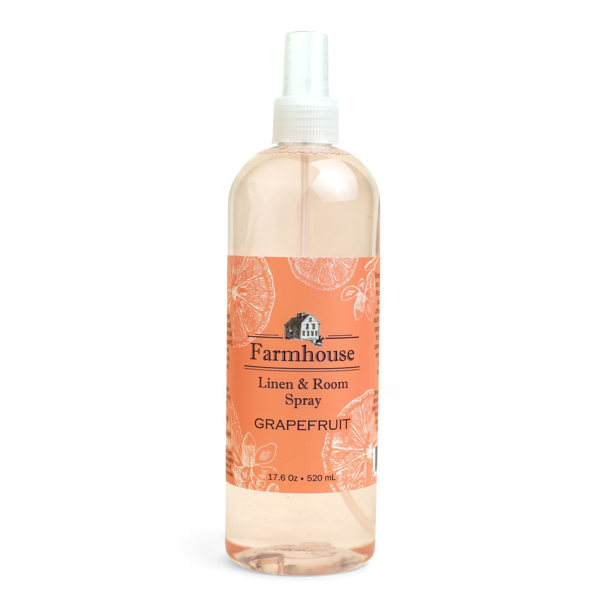 A clear spray bottle labeled 'Farmhouse Linen & Room Spray Grapefruit'.