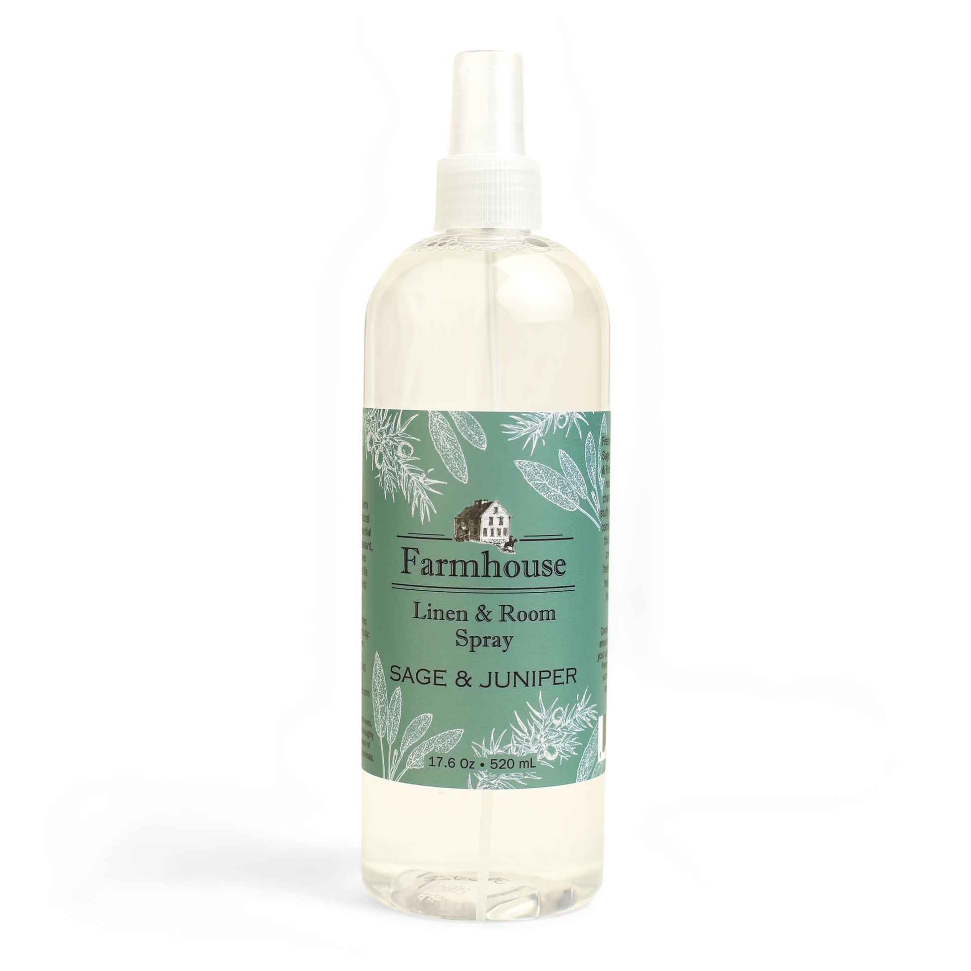 A clear spray bottle labeled 'Farmhouse Linen & Room Spray Sage & Juniper'.