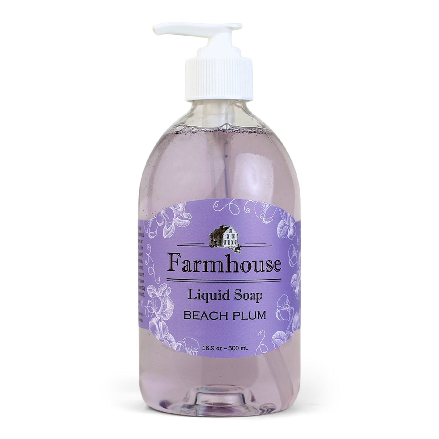 A clear pump bottle of Farmhouse liquid soap with a purple label that reads 'Liquid Soap' and 'Beach Plum'.