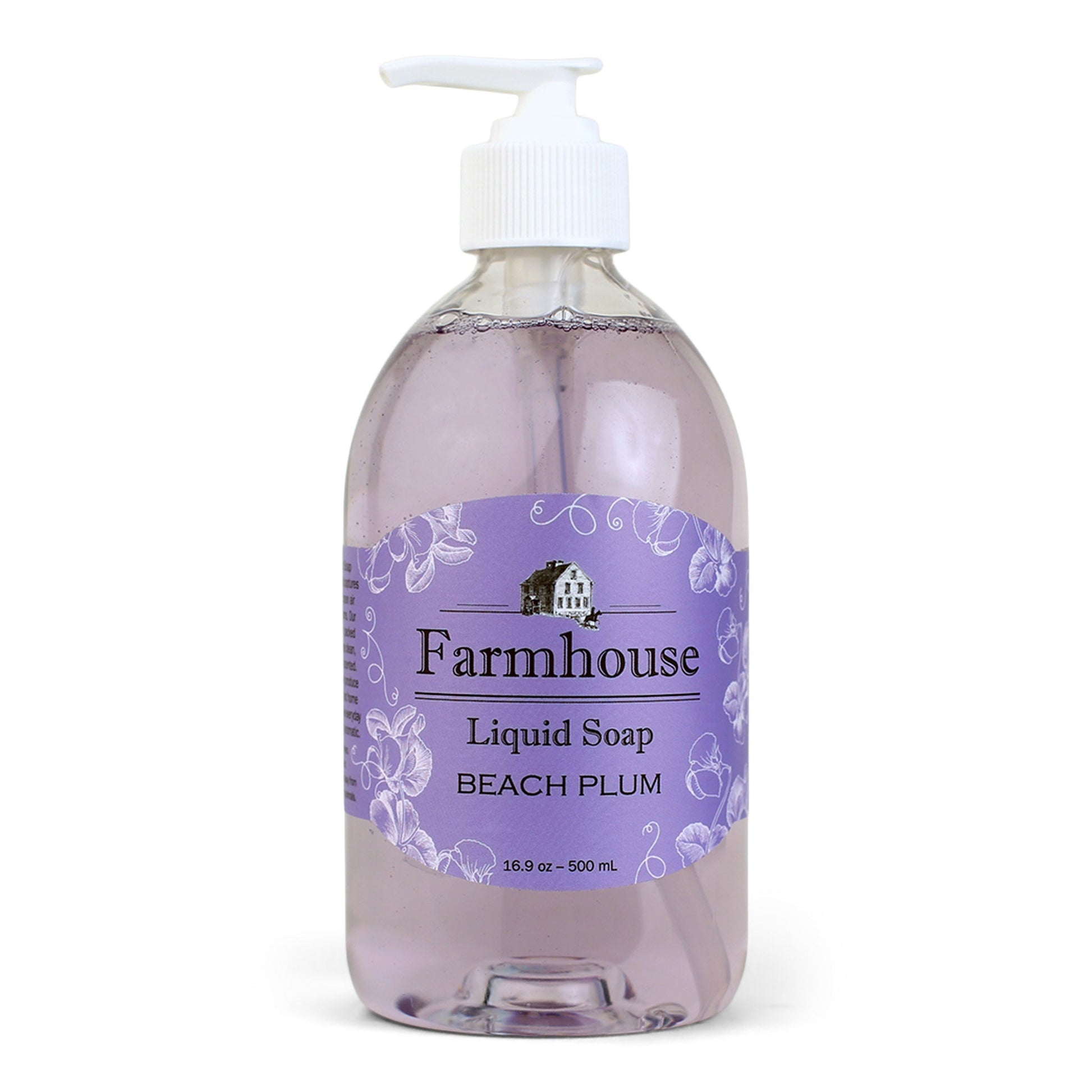 A clear pump bottle of Farmhouse liquid soap with a purple label that reads 'Liquid Soap' and 'Beach Plum'.