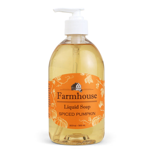 A clear pump bottle of Farmhouse liquid soap with an orange label that reads 'Liquid Soap' and 'Spiced Pumpkin'.