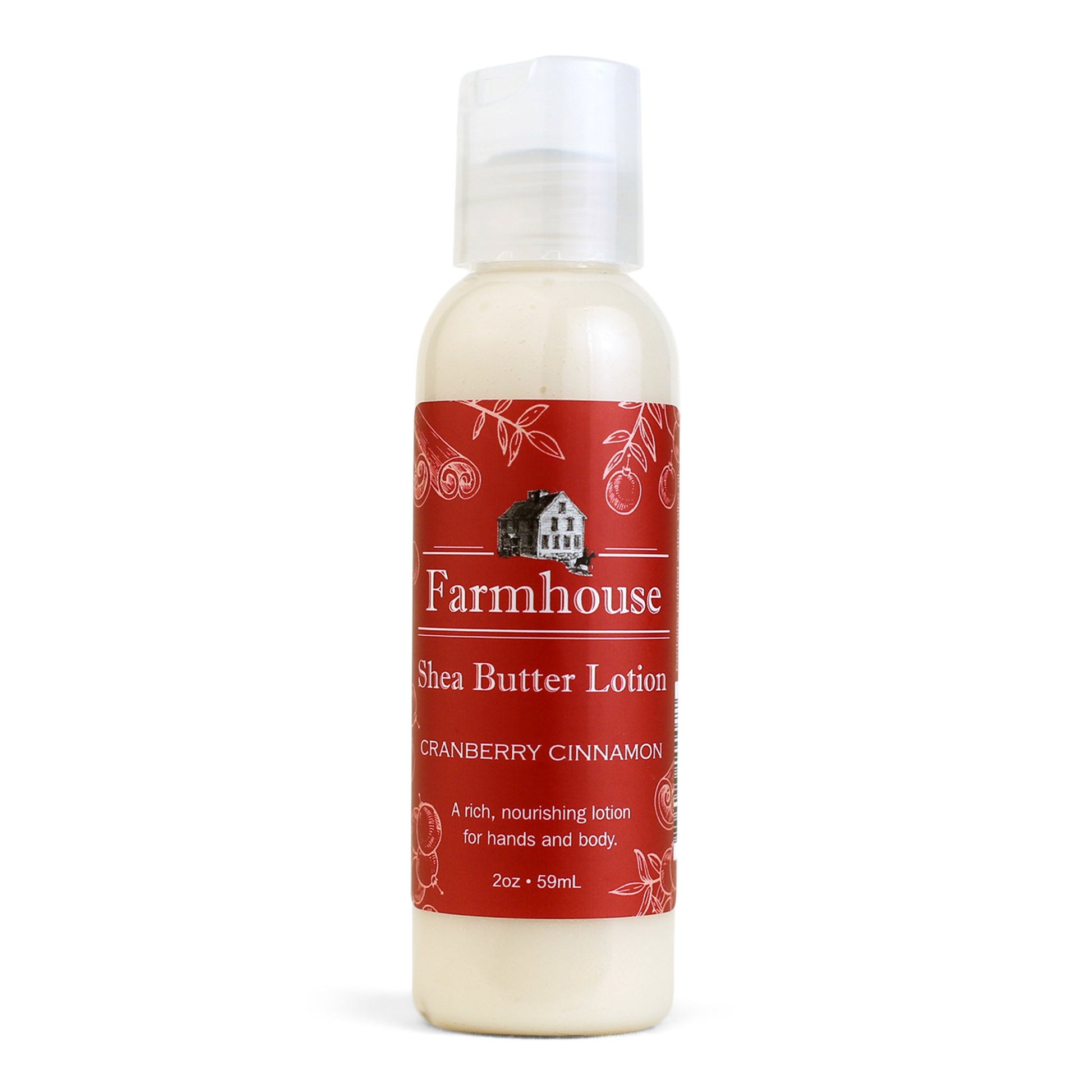 A mini bottle of Farmhouse Shea Butter Lotion with the label showing 'Cranberry Cinnamon'.