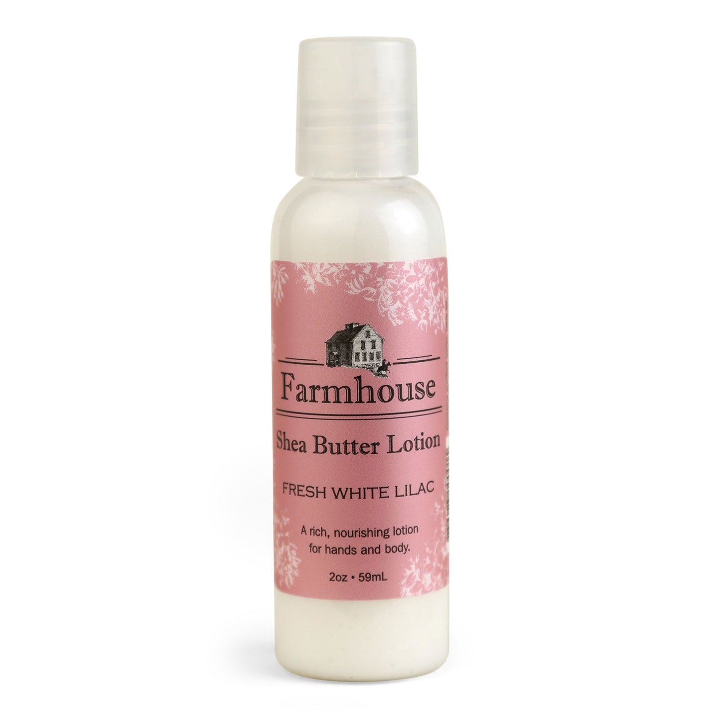 A mini bottle of Farmhouse Shea Butter Lotion with the label showing 'Fresh White Lilac'.