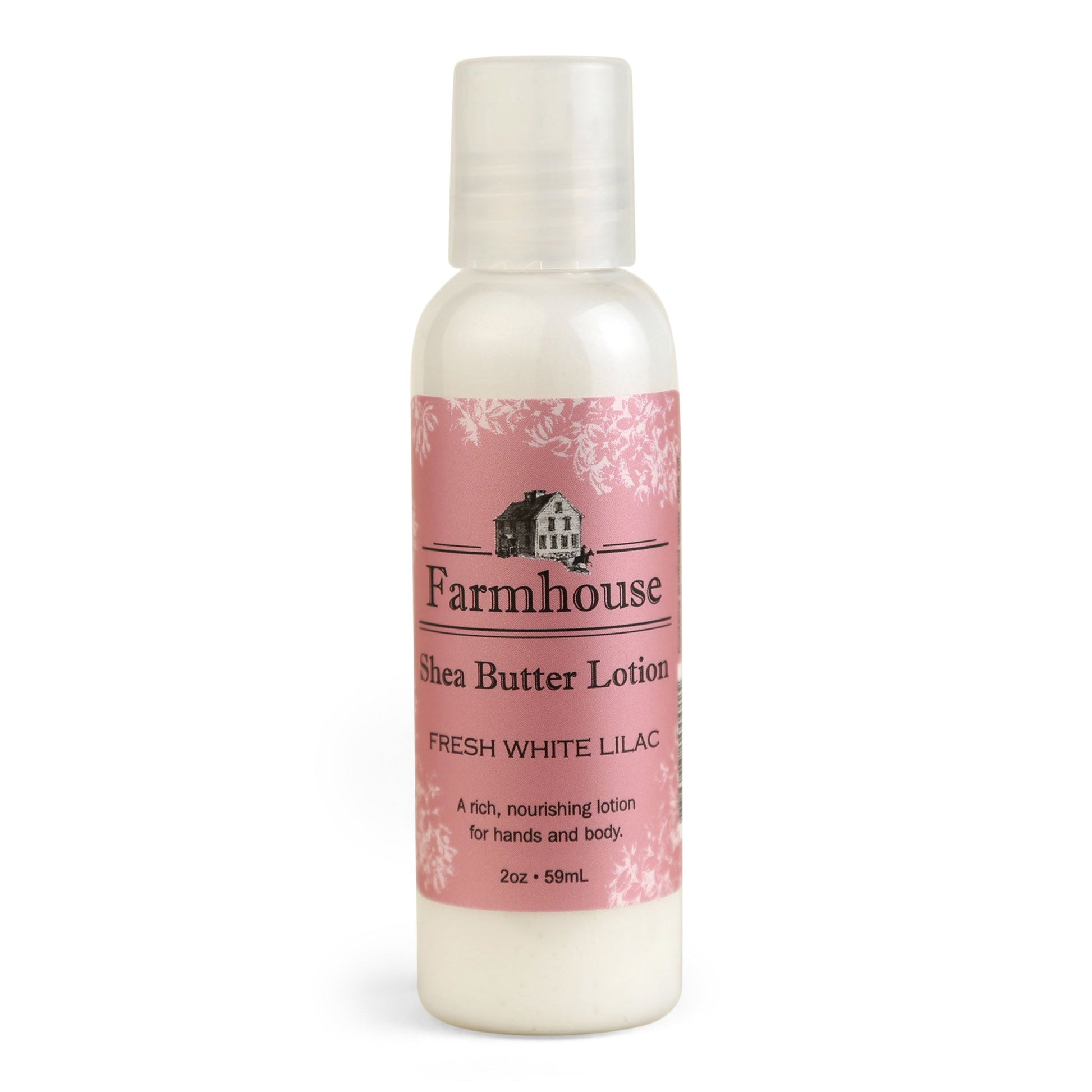 A mini bottle of Farmhouse Shea Butter Lotion with the label showing 'Fresh White Lilac'.