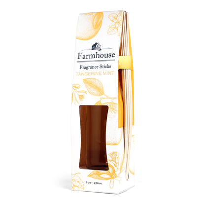 A package of Farmhouse Fragrance Sticks with a tangerine mint scent, featuring a square glass jar and rattan reeds.