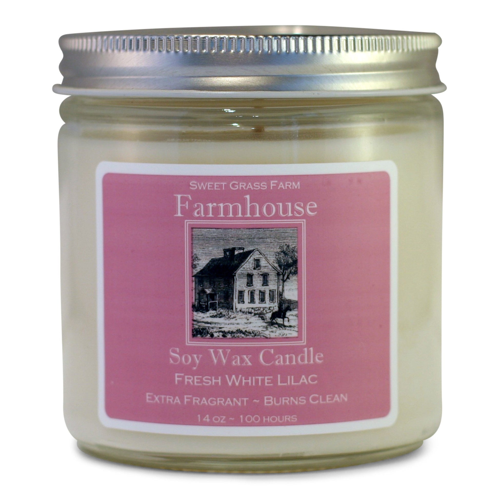 A soy wax candle jar with a label that reads 'Farmhouse Soy Wax Candle, Fresh White Lilac, Extra Fragrant - Burns Clean', with a picture of a house and the brand name 'Sweet Grass Farm'.