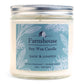 A soy wax candle jar with a label that reads 'Farmhouse Soy Wax Candle, Sage & Juniper, Extra Fragrant - Burns Clean', with a picture of a house and the brand name 'Sweet Grass Farm'.