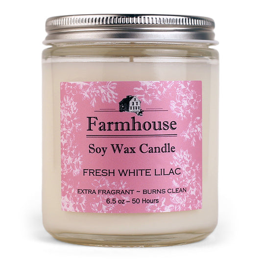 Farmhouse soy wax candle with fresh white lilac fragrance on a pink label