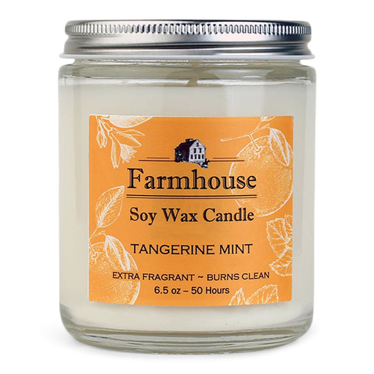 Farmhouse soy wax candle with tangerine mint fragrance on an orange label