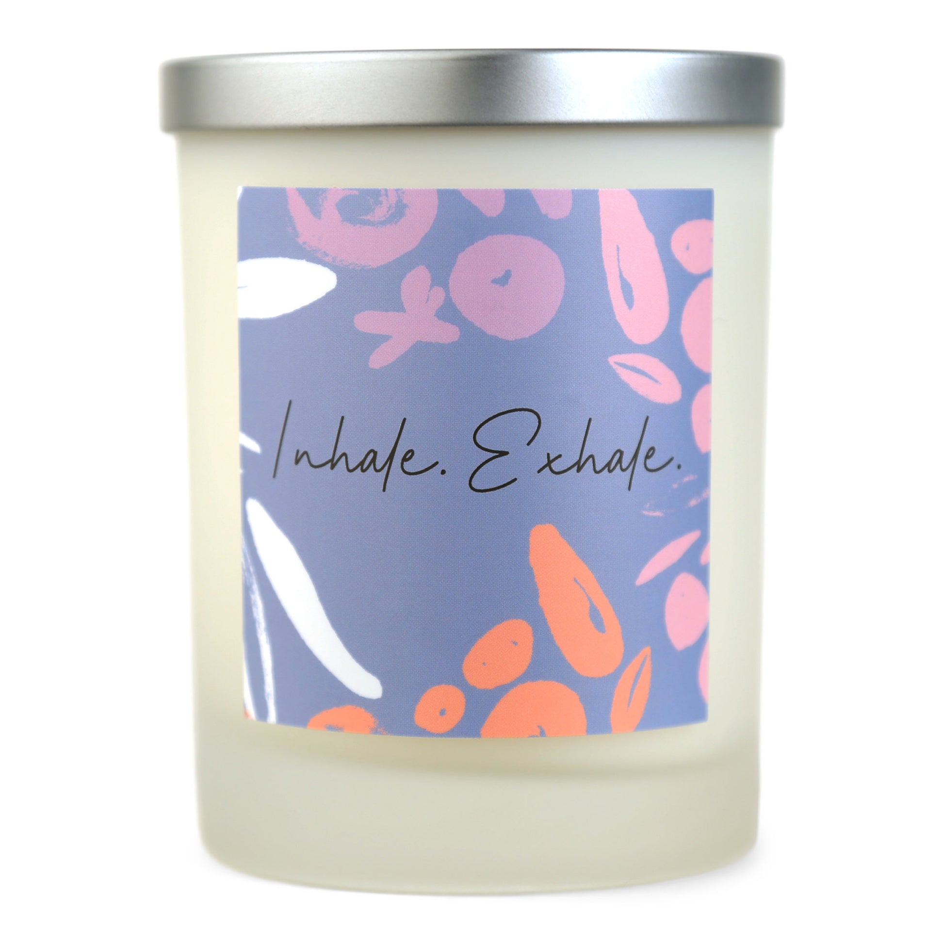 A white soy wax candle with a label that has 'Inhale.Exhale.' written on it and colorful abstract shapes.