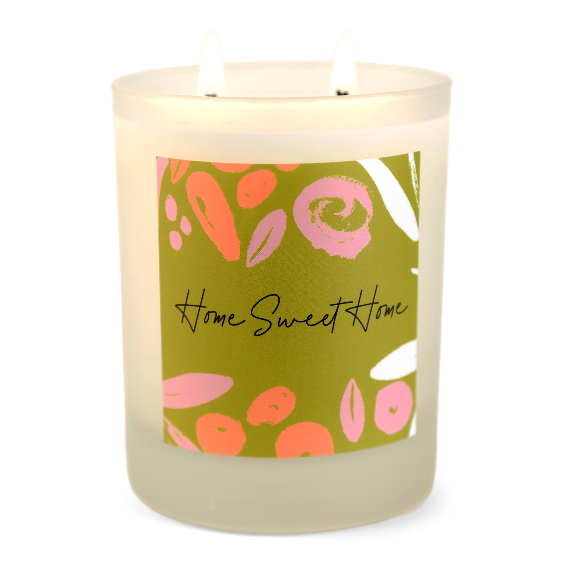 A white soy wax candle with a label that has 'Home Sweet Home' written on it and colorful abstract shapes.