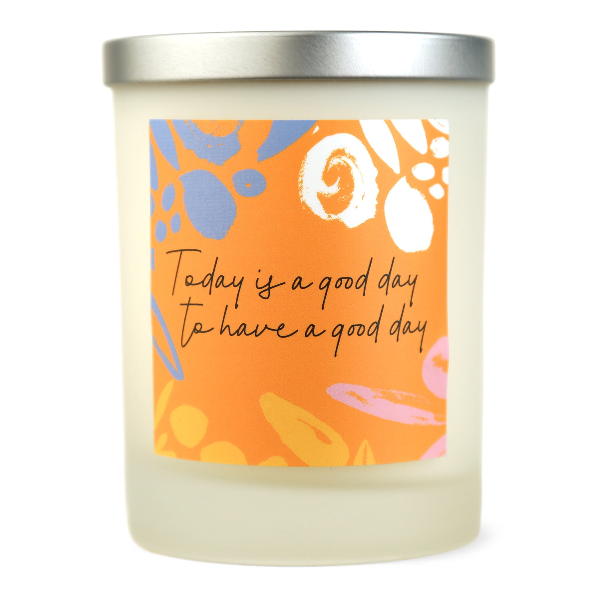 A white soy wax candle with a label that has 'Today is a good day to have a good day' written on it and colorful abstract shapes.