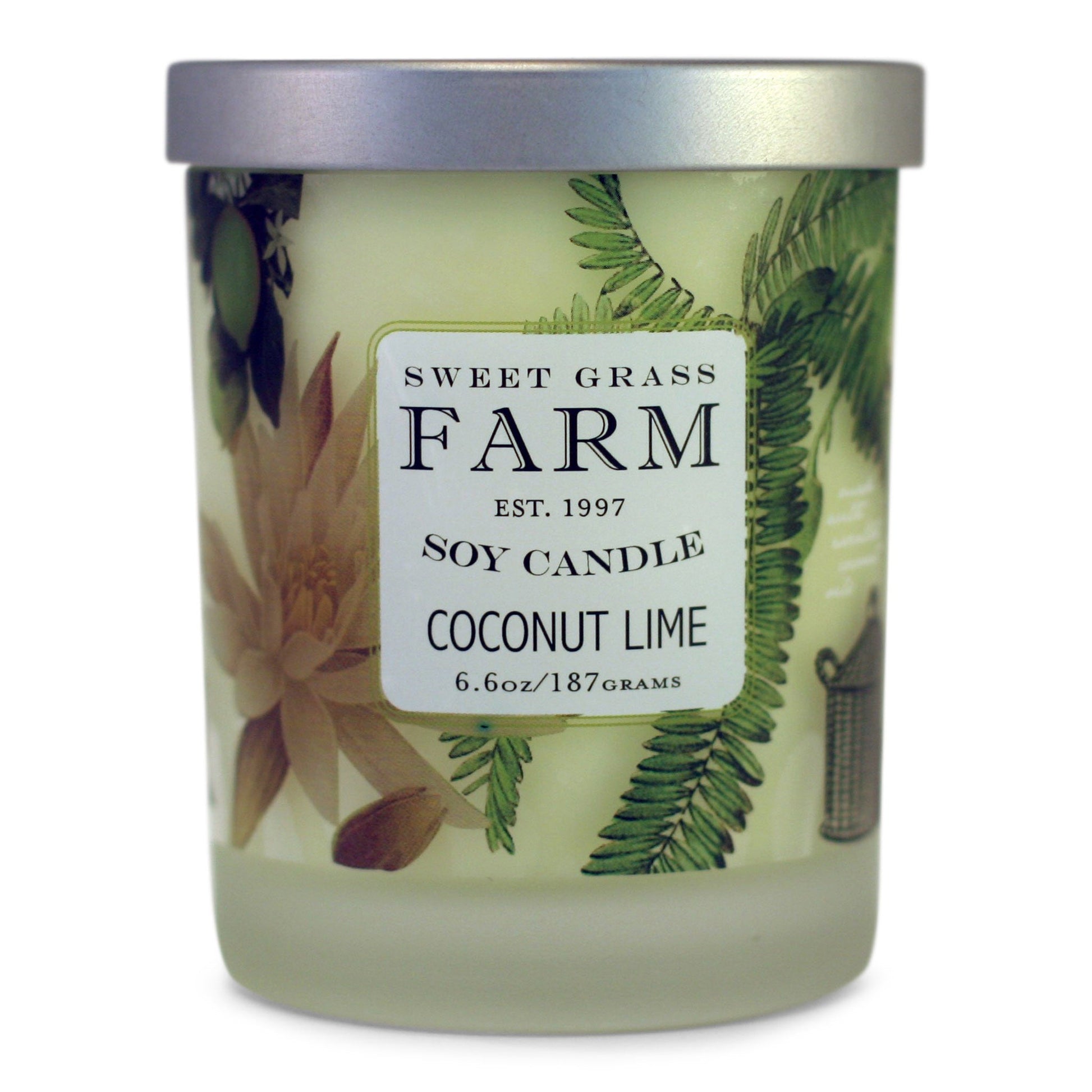 A soy wax candle in a clear tumbler with a label that reads 'Sweet Grass Farm Soy Candle, Coconut Lime', with tan and green botanical images in the background.