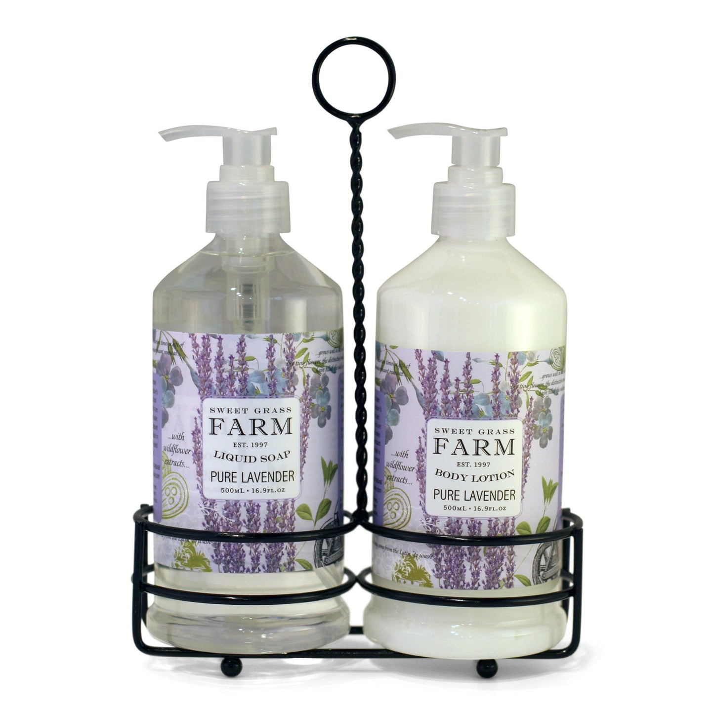 Two pump bottles of body lotion and liquid soap in a black metal caddy, with labels indicating the product Sweet Grass Farm, Meadow Collection, pure lavender scent