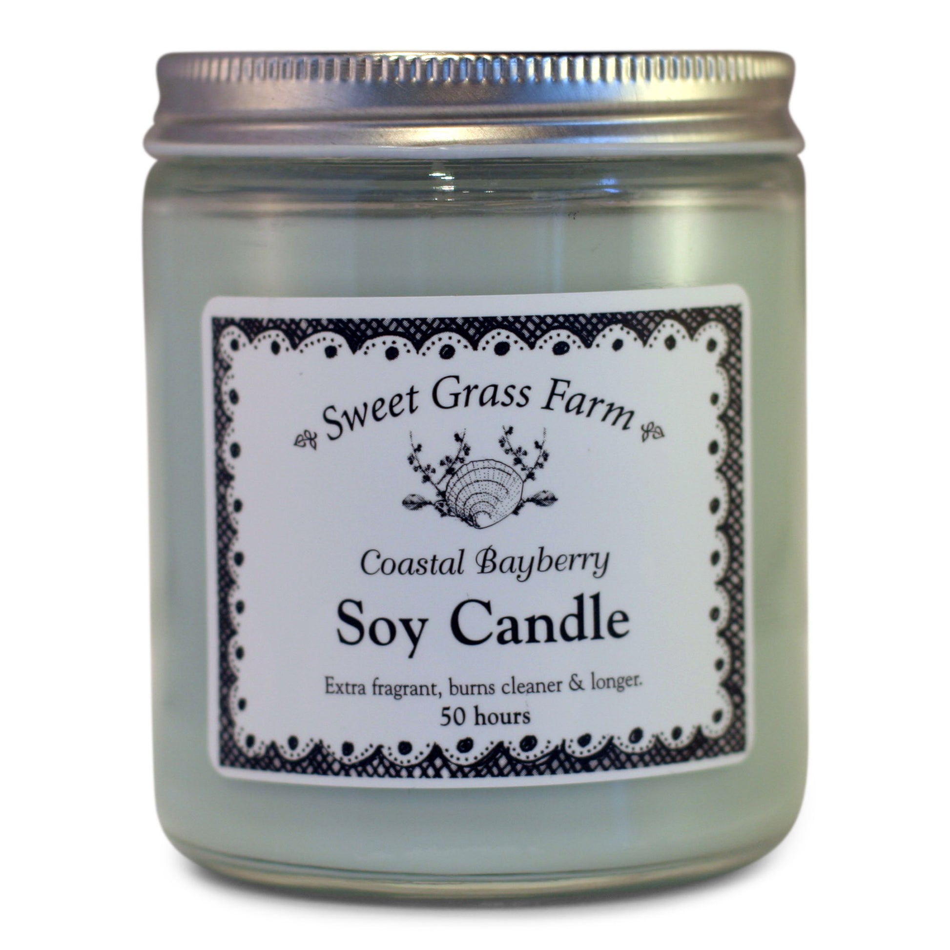 A soy wax candle in a clear glass jar with a label reading 'Sweet Grass Farm Coastal Bayberry Soy Candle', with a definition stating 'Extra fragrant, burns cleaner & longer 50 hours'.